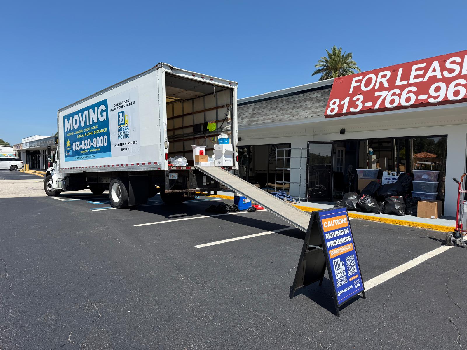 Adela & Brothers Moving branded truck at a Tampa Bay job site