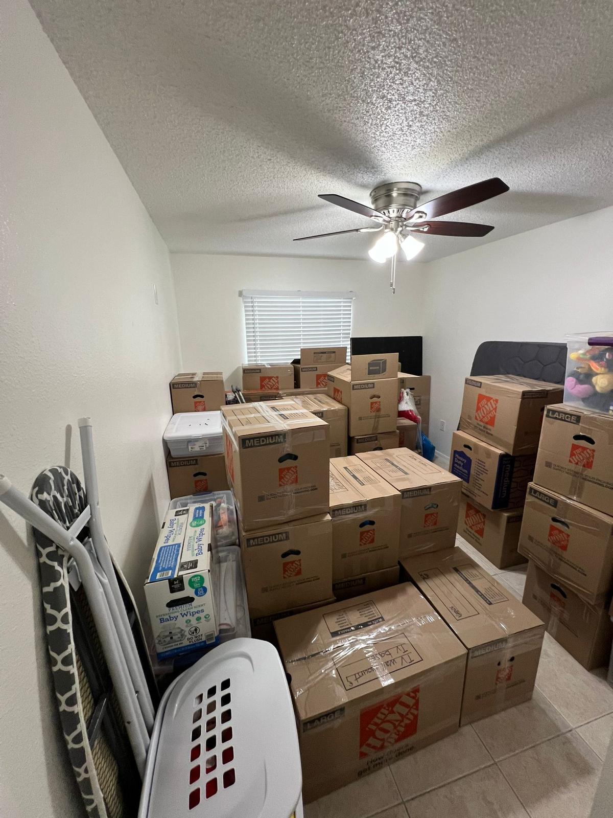 Room fully packed and ready to move by Adela & Brothers Moving