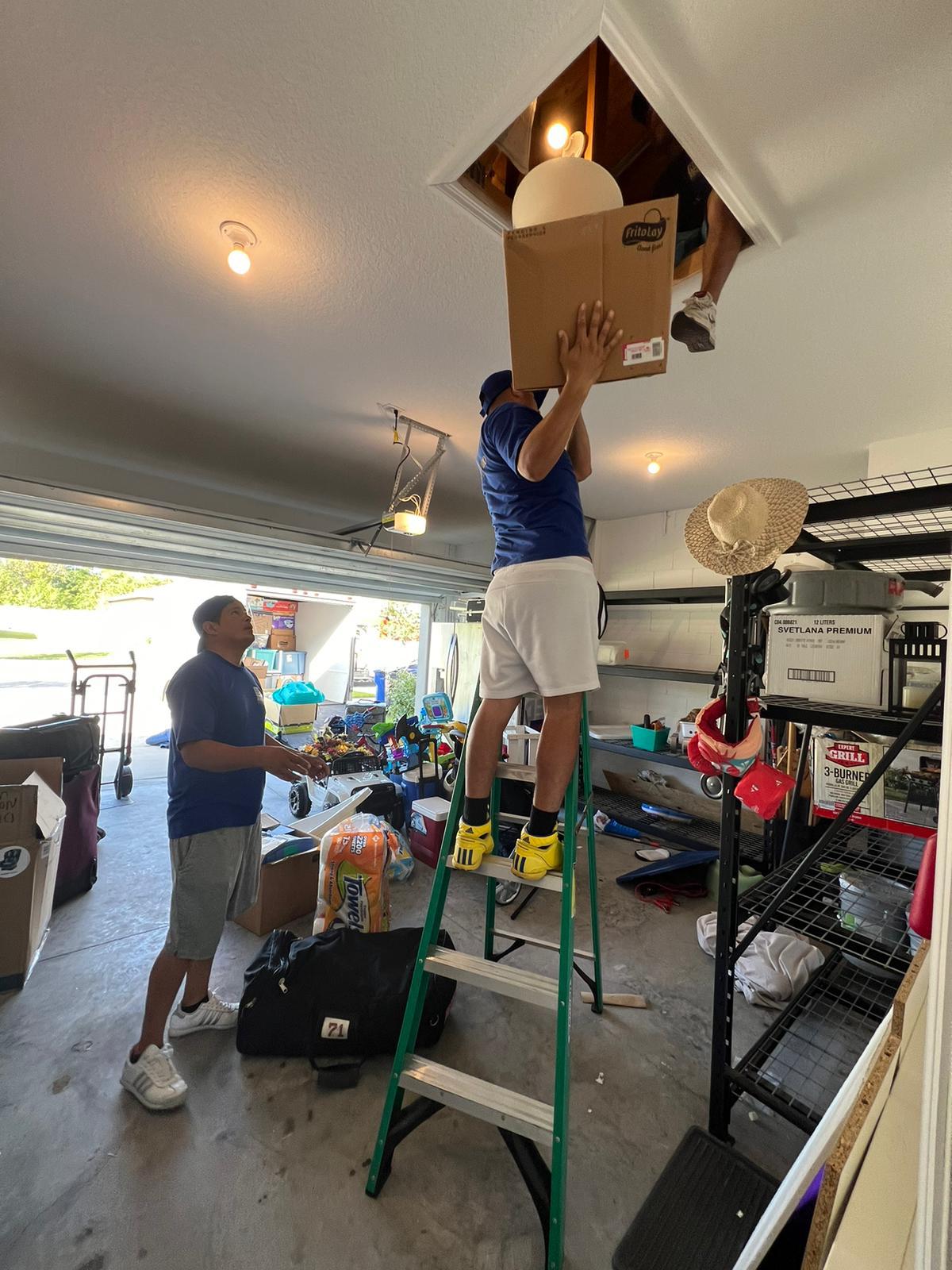 Junk removal team clearing a Tampa Bay garage
